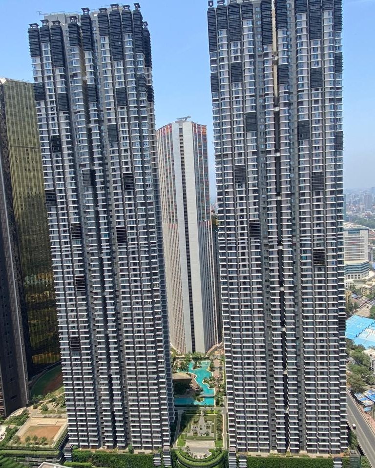 Aerial view of the twin residential towers of Lodha The Park, Mumbai, with the podium garden and pool between them