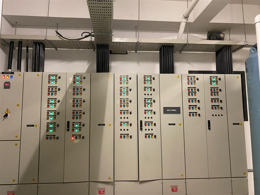 MCC panel line-up with cable risers from the tray above