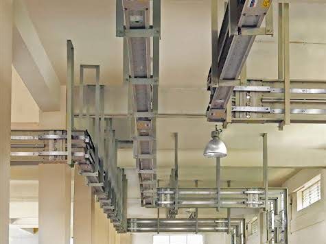 Overhead busduct runs above an LT panel room