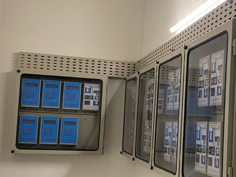 Wall-mounted control panels with perforated cable tray